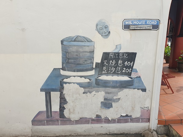 Penang Street Art man selling Pau