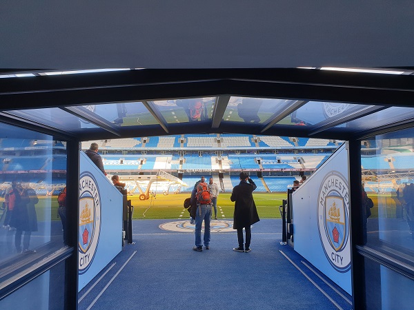 Walk down the player's tunnel out to the pitch