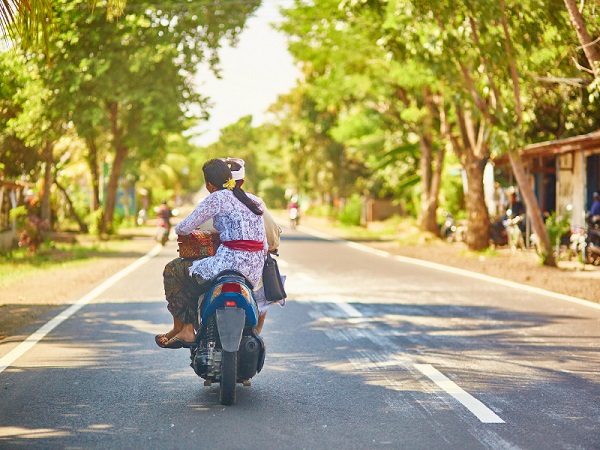 locals wearing no helmets