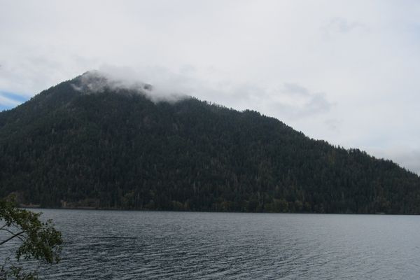 Gentle, forested mountain peaks surround Lake Crescent.